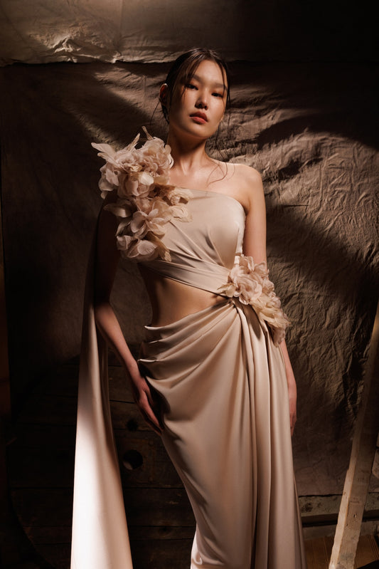The draped beige satin dress